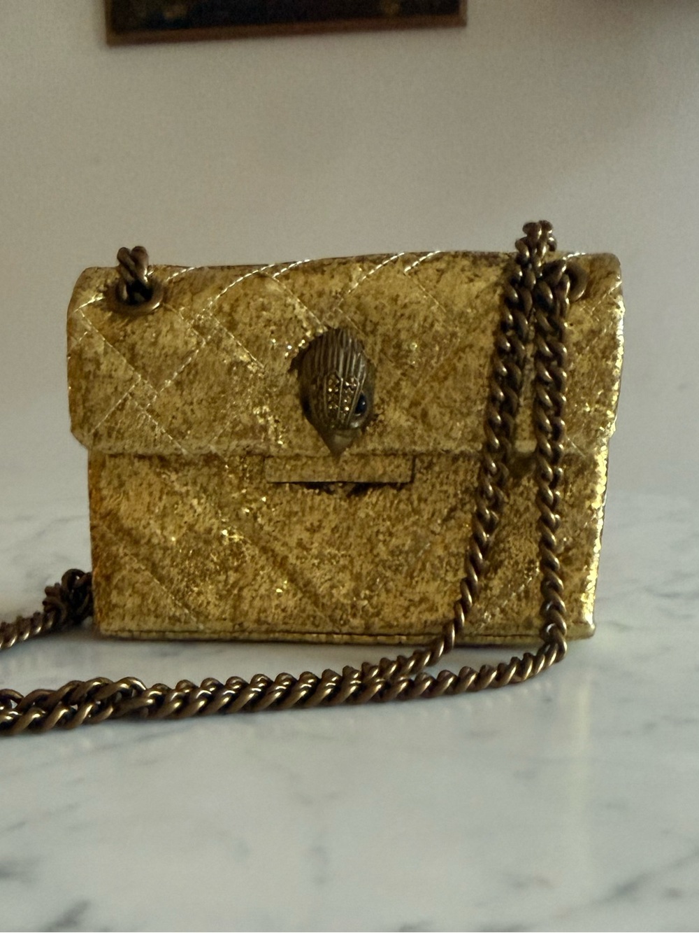 Gold Quilted Chain Crossbody Bag with Decorative Clasp